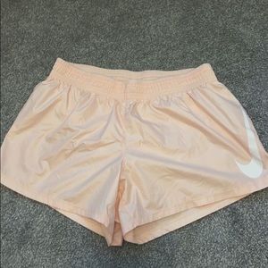 Pink Nike running shorts